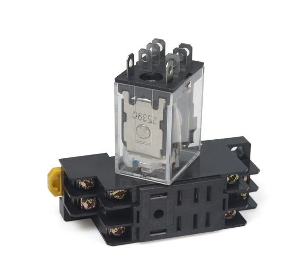 Electrical auxiliary relay in a transparent plastic case and black socket isolated on white background.