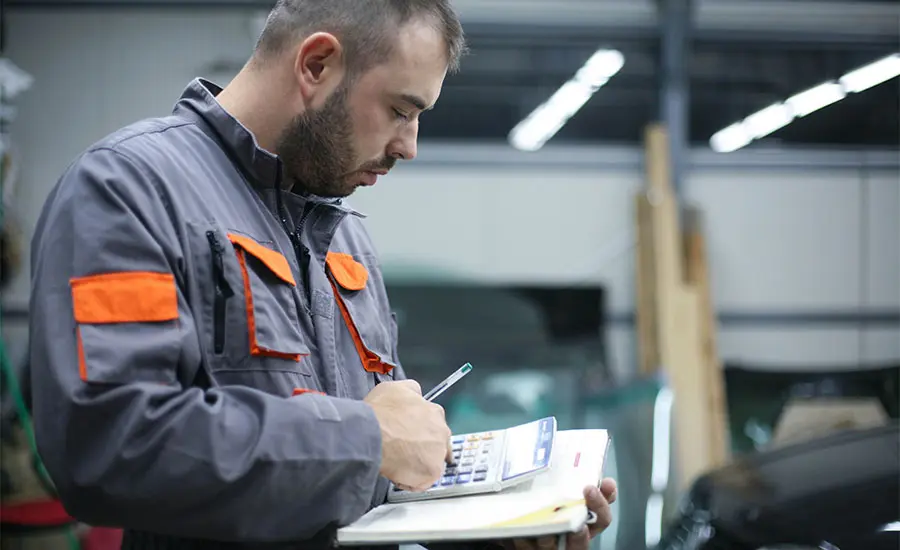 A person holding a calculator