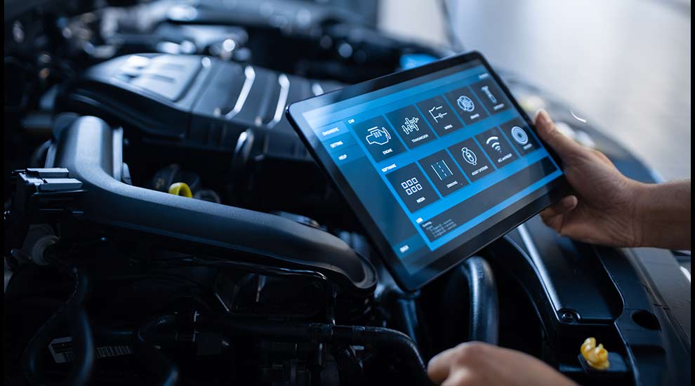 A person checking components of a car